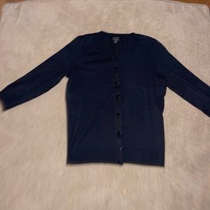 Black long sleeve button up sweater.